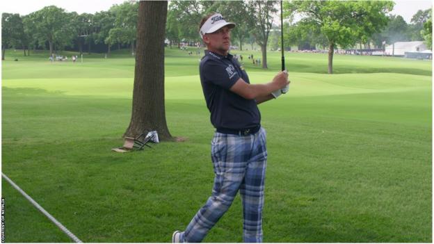 English golfer Ian Poulter surveys his shot