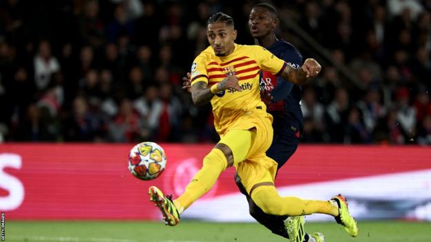 Barcelona's Raphinha scores against Paris St-Germain in the Champions League quarter-final first leg in Paris