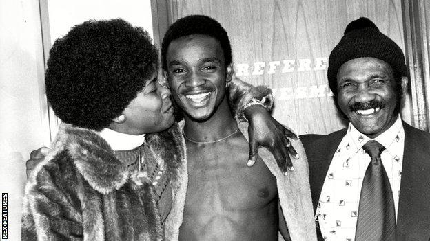 A young Laurie Cunningham, pictured with his mum Mavis and dad Elias