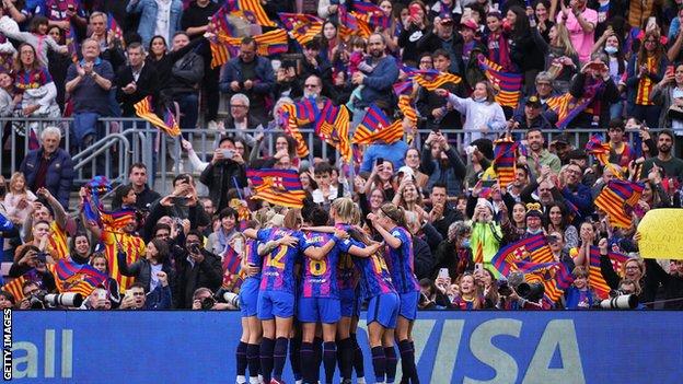 Barcelona team celebrate in front of the fans