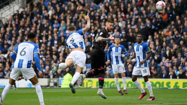 Brentford's Pontus Jansson opens the scoring against Brighton at Amex Stadium