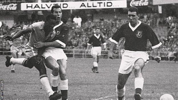 Pele comes under pressure from Wales defenders Mel Charles and Stuart Williams (right)