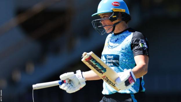 Grace Harris of the Heat shows off her broken bat during the WBBL match between Perth Scorchers and Brisbane Heat at North Sydney Oval