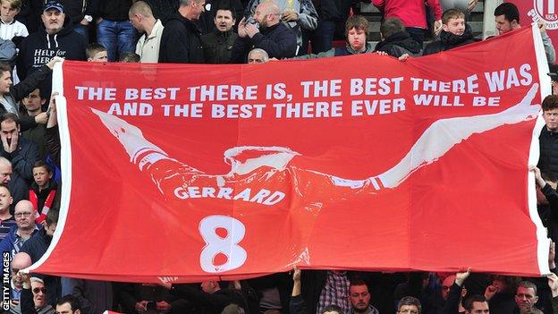 Liverpool fans hold up a banner in tribute to Steven Gerrard