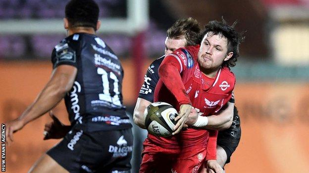 Scarlets' Steff Evans takes on Dragons
