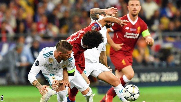 Salah damaged his shoulder under challenge from Sergio Ramos