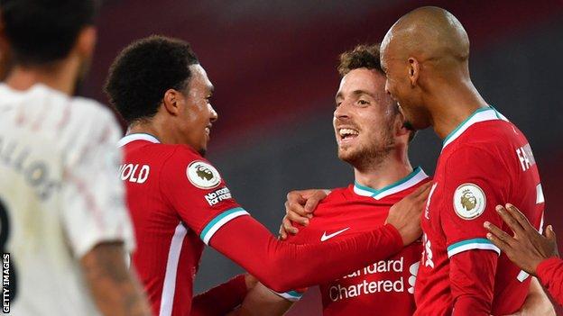 Diogo Jota celebrates with team-mates Trent Alexander-Arnold and Fabinho