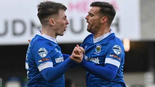 Chris McKee and Matthew Clarke celebrate Linfield's opening goal against Dungannon