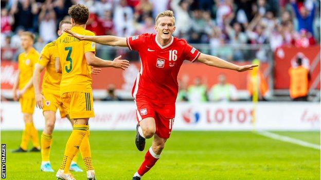 Karol Swiderski celebrates