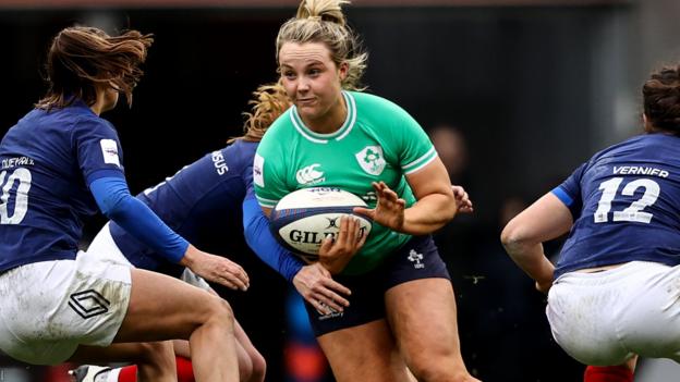 Aoife Dalton carries ball in midfield for Ireland against France