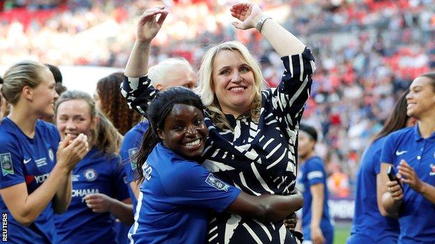 Chelsea striker Eniola Aluko hugs manager Emma Hayes after winning the FA Cup