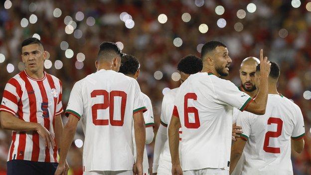 Morocco captain Romain Saiss leads his troops in Monday's draw with Paraguay