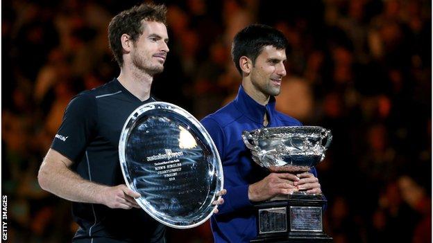 Andy Murray and Novak Djokovic both holding trophies