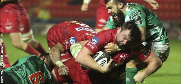 David Bulbring of Scarlets is held short of the try line