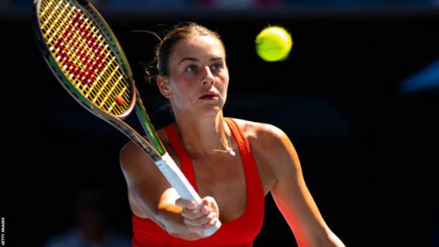 Marta Kostyuk returns the ball during the Australian Open