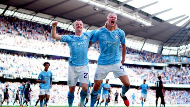 Erling Haaland celebrates with Sergio Gomez after scoring his fifth Premier League hat-trick.