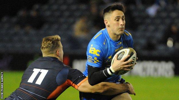Dragons' Sam Davies is tackled by Edinburgh's Duhan van der Merwe