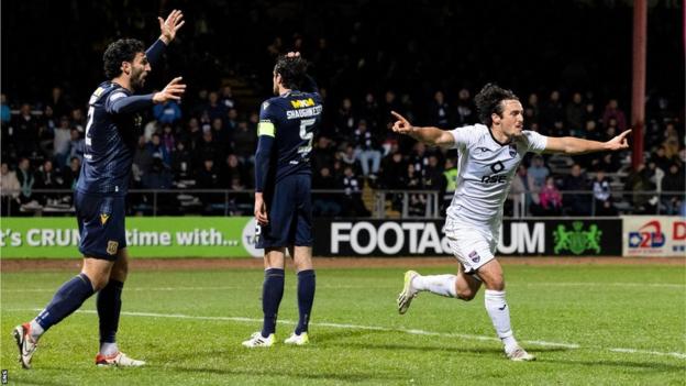 James Brown celebrates before his strike is chalked off