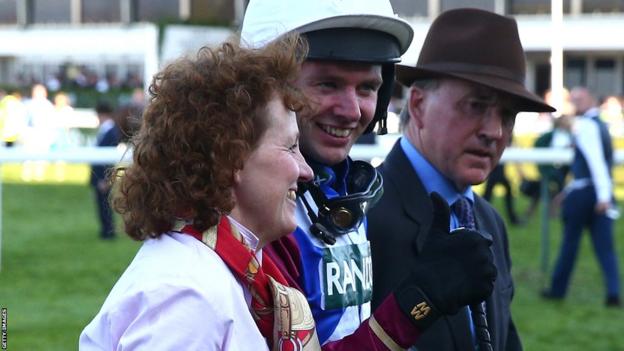 Russell (left) with jockey Derek Fox after One For Arthur won the 2017 Grand National