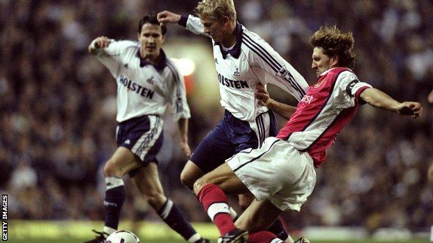 Tony Adams makes a tackle