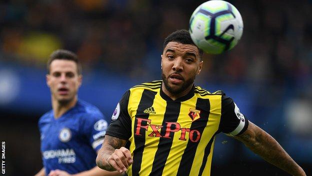 Troy Deeney in action for Watford in a game against Chelsea
