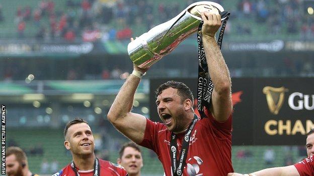Tadgh Beirne celebrates with the Pro12 trophy after Scarlets' win over Munster in the 2016-17 final