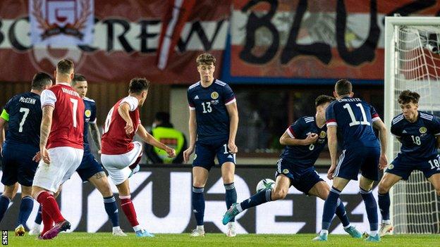 Scotland squandered a two-goal lead and lost a late equaliser to draw with Austria in Vienna