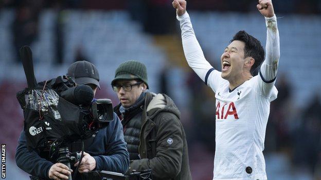Son Heung-Min of Tottenham Hotspur celebrates at the final whistle with TV cameras filming him
