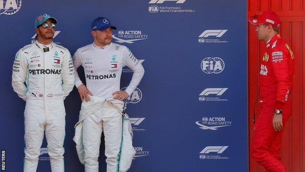 Mercedes teammates Lewis Hamilton and Valtteri Bottas alongside Ferrari's Sebastian Vettel