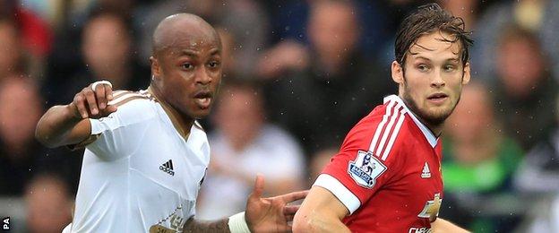 Andre Ayew (left) with Daley Blind