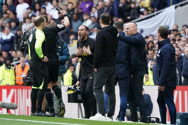 Cristian Stellini is shown a red card