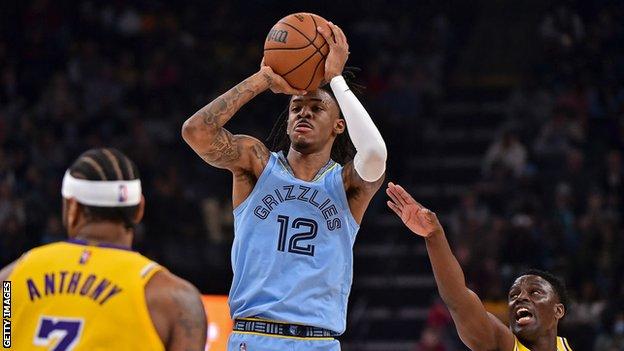 Ja Morant of the Memphis Grizzlies looks on against the Los