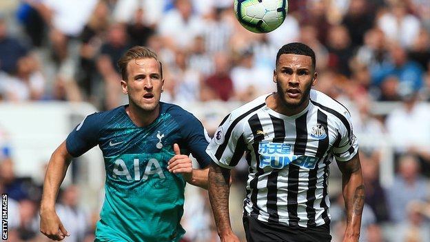 Tottenham's Harry Kane chases the ball with Newcastle's Jamaal Lascelles