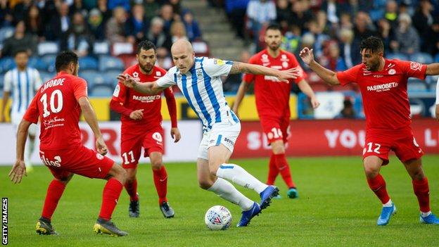 Aaron Mooy in action for Huddersfield