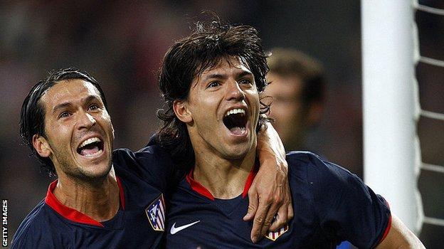 Where it all began: Aguero (r) celebrates with Luis Garcia after scoring his first Champions League goal, which came for Atletico Madrid against PSV in September 2008