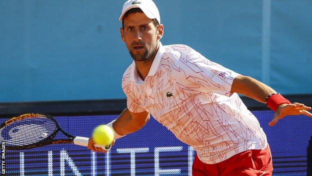 Novak Djokovic hits a forehand