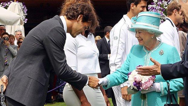Roger Federer shakes hands with the Queen at Wimbledon in 2010