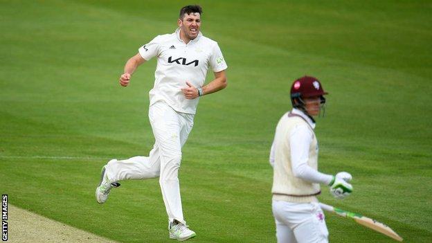 Jamie Overton celebrating a wicket for Surrey