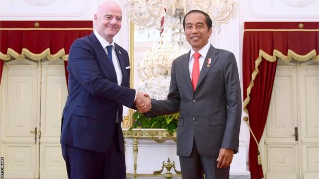 Indonesian President Joko Widodo welcomes FIFA President Gianni Infantino, left, during an official visit at Istana Merdeka in Jakarta, Indonesia on October 18, 2022