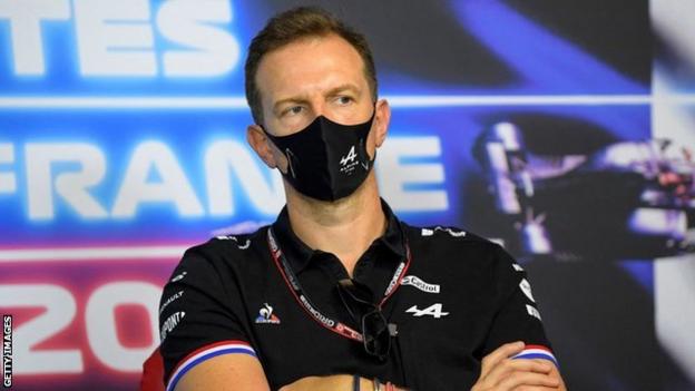 Laurent Rossi with folded arms at a press conference