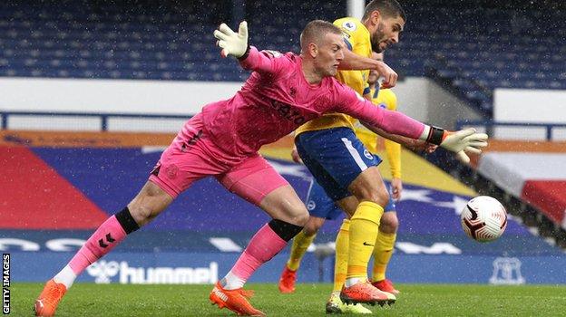 Jordan Pickford fumbles the ball versus Brighton. His mistake led to a Seagulls goal.