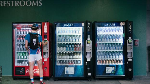 James Poole buys drinks from vending machines connected  the 2022 The Speed Project