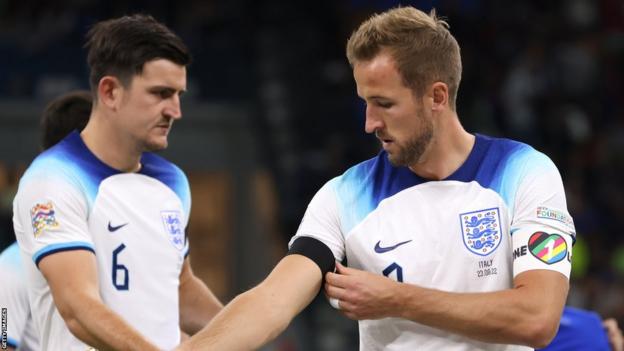 England players Harry Maguire and Harry Kane wearing black armbands during a match against Italy
