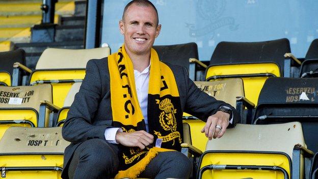 Kenny Miller poses with a Livingston scarf