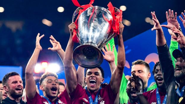 Trent Alexander-Arnold lifting the Champions League trophy in 2019