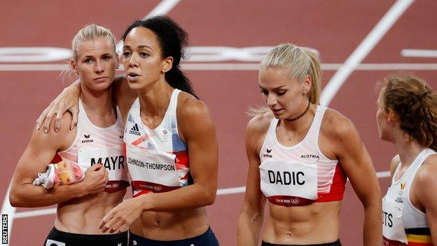 Katarina Johnson-Thompson is consoled by her heptathlon rivals at Tokyo 2020