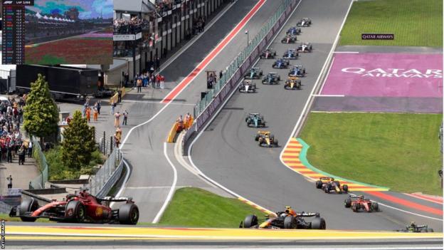 Charles Leclerc leads through Eau Rouge on the opening lap of the Belgian Grand Prix