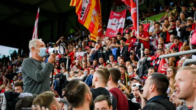 Streich speaks to supporters after Freiburg's final game at their former home - the Dreisamstadion - in September 2021