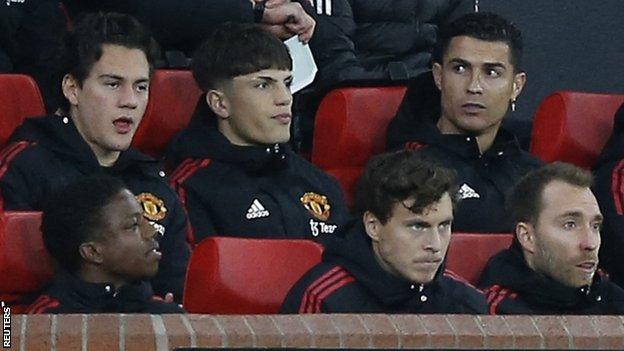 Cristiano Ronaldo watches from the Manchester United bench