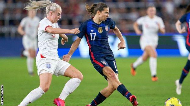 Tobin Heath against England's Alex Greenwood